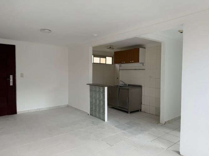 Bright living room space with large windows ceramic tile floors Río Abajo apartment for sale