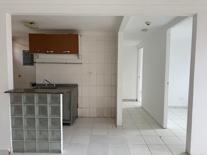 Simple kitchen with glass block breakfast bar in Río Abajo apartment for sale Panama City