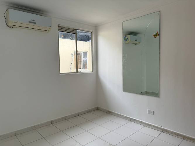 Bedroom with split AC and mirror tiled floors Río Abajo apartment sale