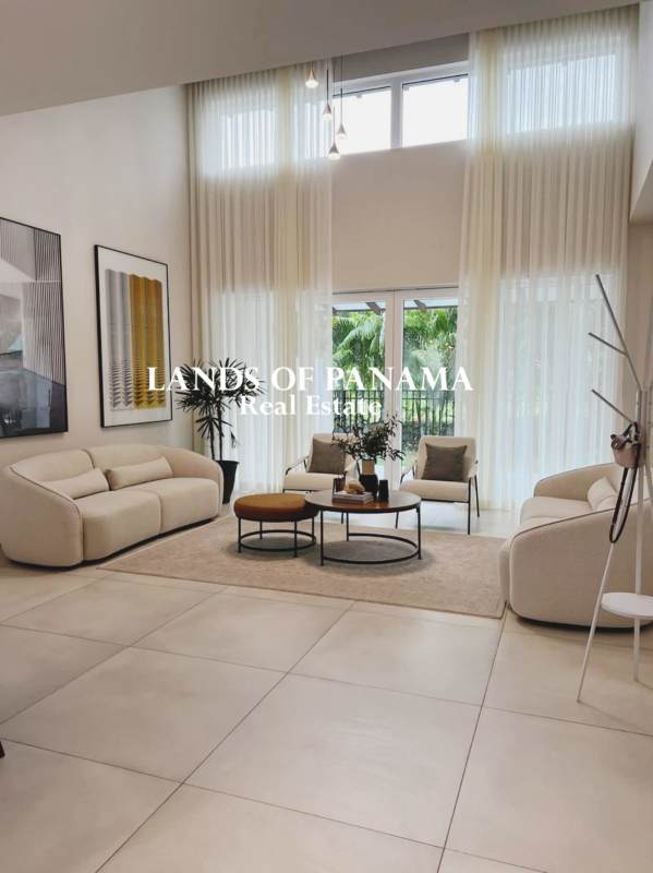 Large open-plan dining and living room with natural light at The Woods Santa María Panama luxury house