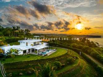Lap swimming pool with ocean backdrop and lush gardens Pedasí turn key villa