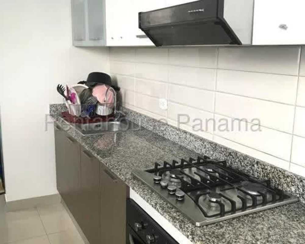 Modern kitchen with granite counters, tile backsplash and natural light in PH Roma Tower San Francisco Panama City