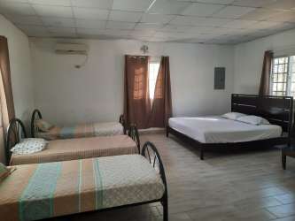 Modern kitchen with island granite countertops and windows country home Panama San Carlos