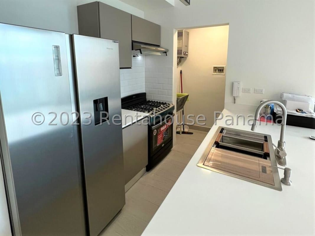 Bright living area with balcony access city skyline view PH Urbana Panama