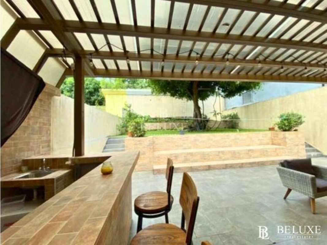 Bright dining room with large windows and sliding door in spacious house Residencial El Doral Panama