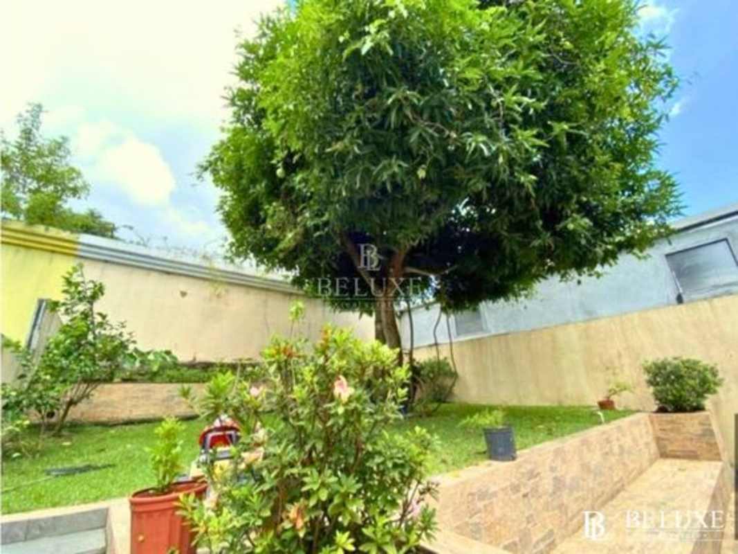 Large bedroom with workspace area and sofa in Residencial El Doral Panama home for sale