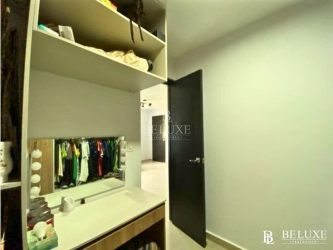 Contemporary bathroom with vessel sink and glass enclosed shower in El Doral home Panama
