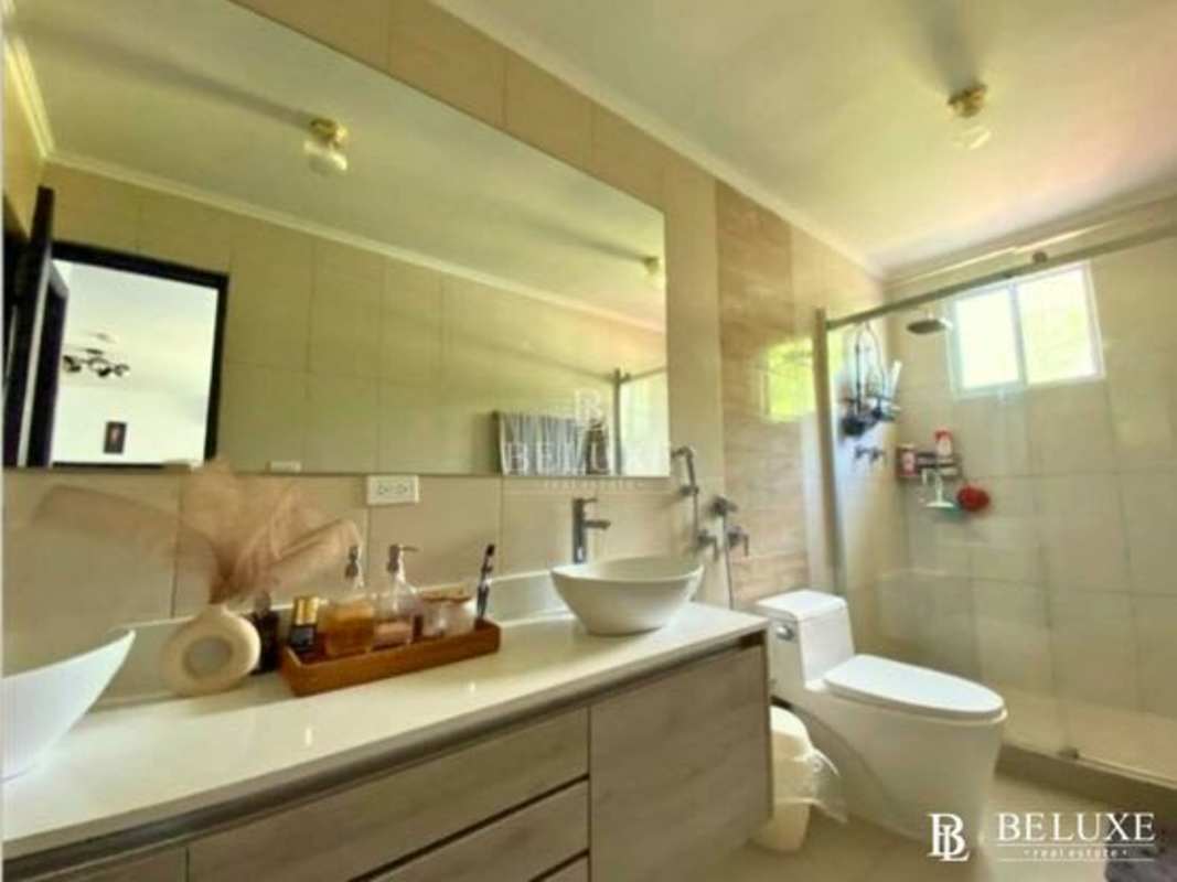 Modern children's bedroom with striped accent wall and large window in Residencial El Doral Panama