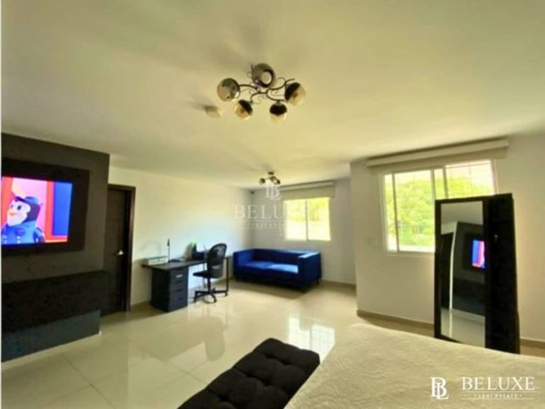 Contemporary bathroom with vessel sink glass shower enclosure in El Doral house Panama