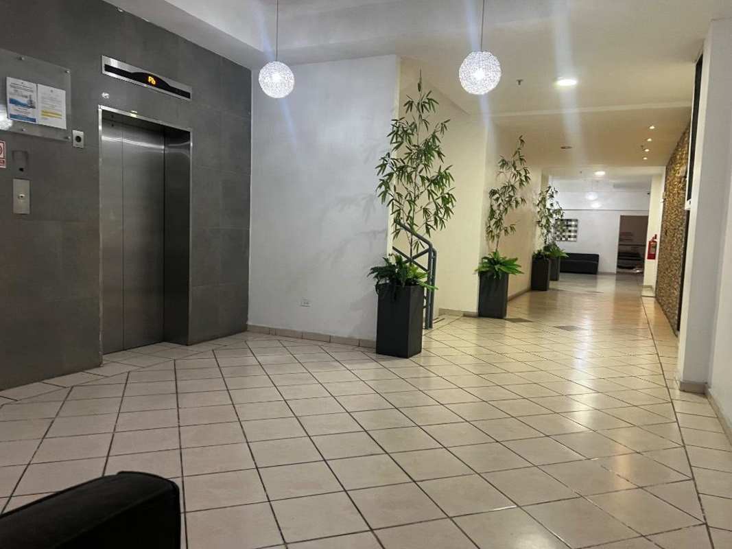 Unfurnished open plan living and kitchen area with tiled floor in PH Plaza Valencia Panama