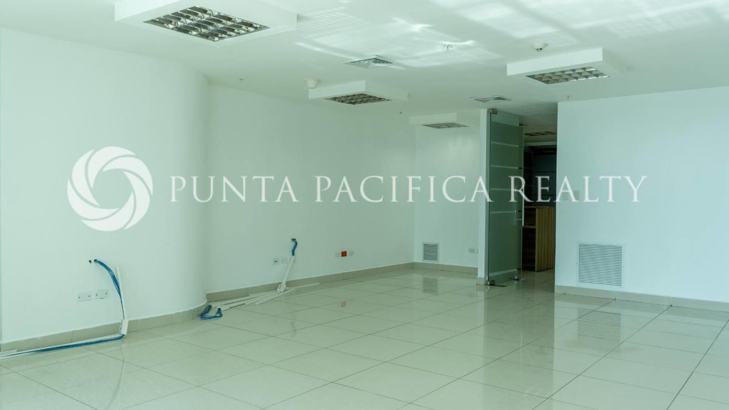 Bright modern commercial office suite with glass walls and skyline view for rent in Oceanía Business Plaza Panama