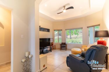 Elegant master bedroom with large windows and terrace access in Boquete Lucero Golf