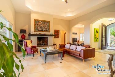 Spacious kitchen with granite countertops, island and wood cabinets in Boquete Lucero home