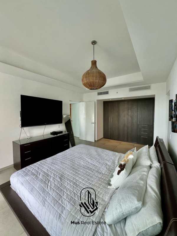 Modern living room with floor-to-ceiling windows and Panama skyline at PH BICSA Avenida Balboa Panama