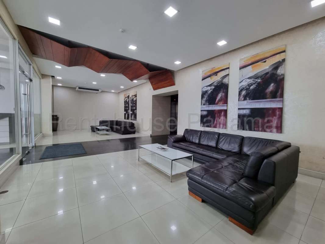 Elegant lobby with black leather sofas and modern decor in PH Plaza Paitilla Panama City