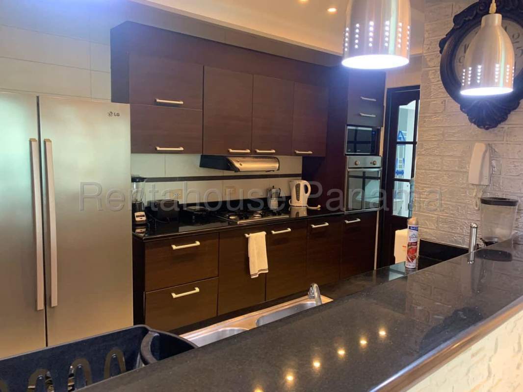 Large modern kitchen with granite countertops, high-end fridge and oven in PH Plaza Paitilla