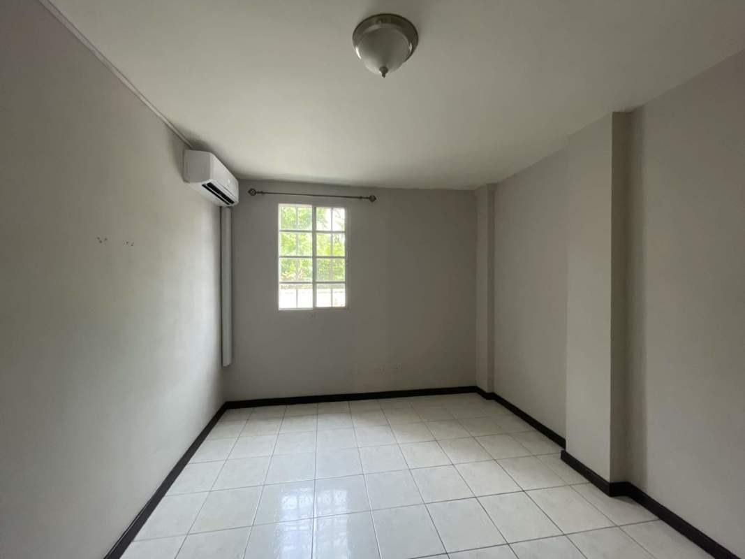 Modern kitchen with granite countertop, gas stove and tile backsplash at PH Albrook Park Panama