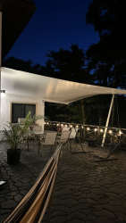 Modern kitchen with stone island and wooden finishes in mountain home Panama