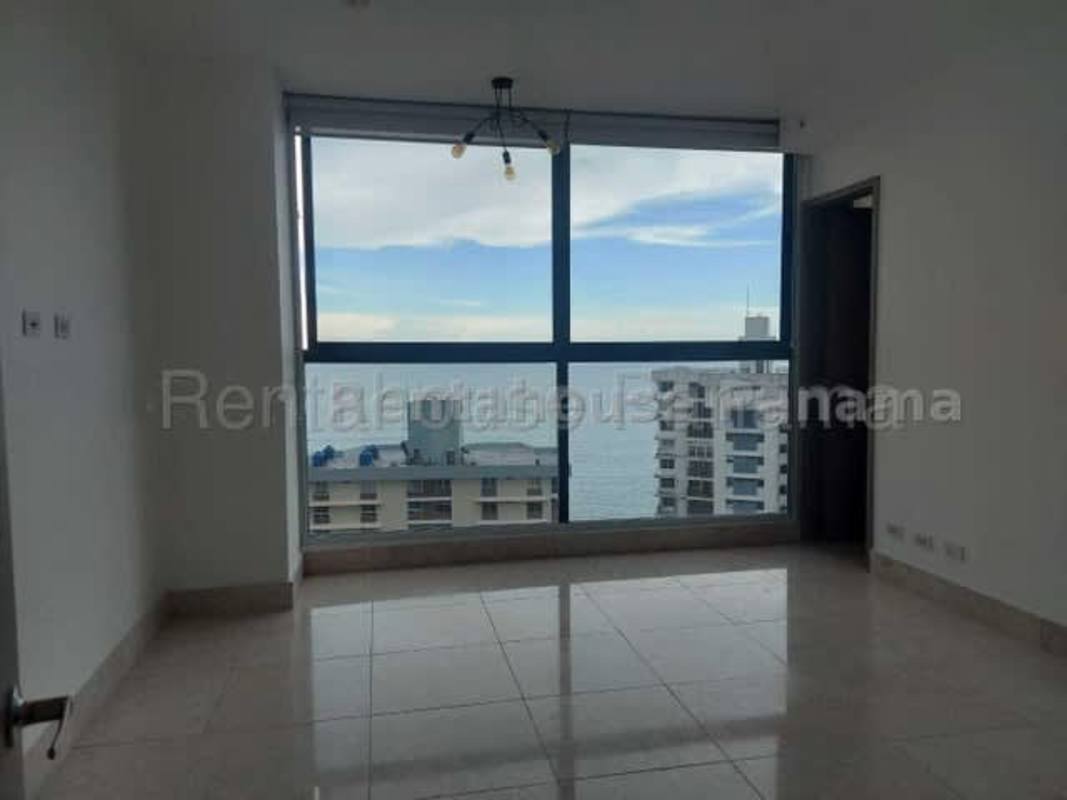 Fully equipped modern kitchen with granite countertops large refrigerator and city window view at PH Punta Paitilla