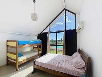 Loft style bright interior vaulted ceilings panoramic windows PH Brisas de Coronado Coronado Panama