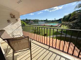 Balcony overlooking tennis courts tropical garden PH Brisas de Coronado Playa Coronado Panama