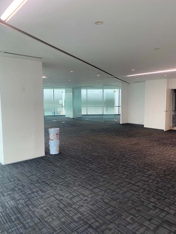 Clean modern commercial bathroom with tile finishes in top office building Costa del Este Panama