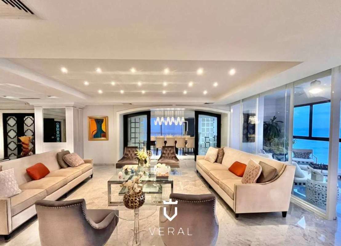 Spacious living room with marble floor, panoramic ocean and skyline view in PH Punta del Sol Panama City