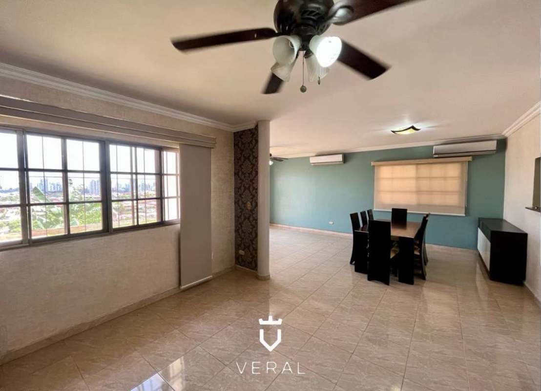 Kitchen with granite countertops, white cabinets, modern appliances in Betania Panama house