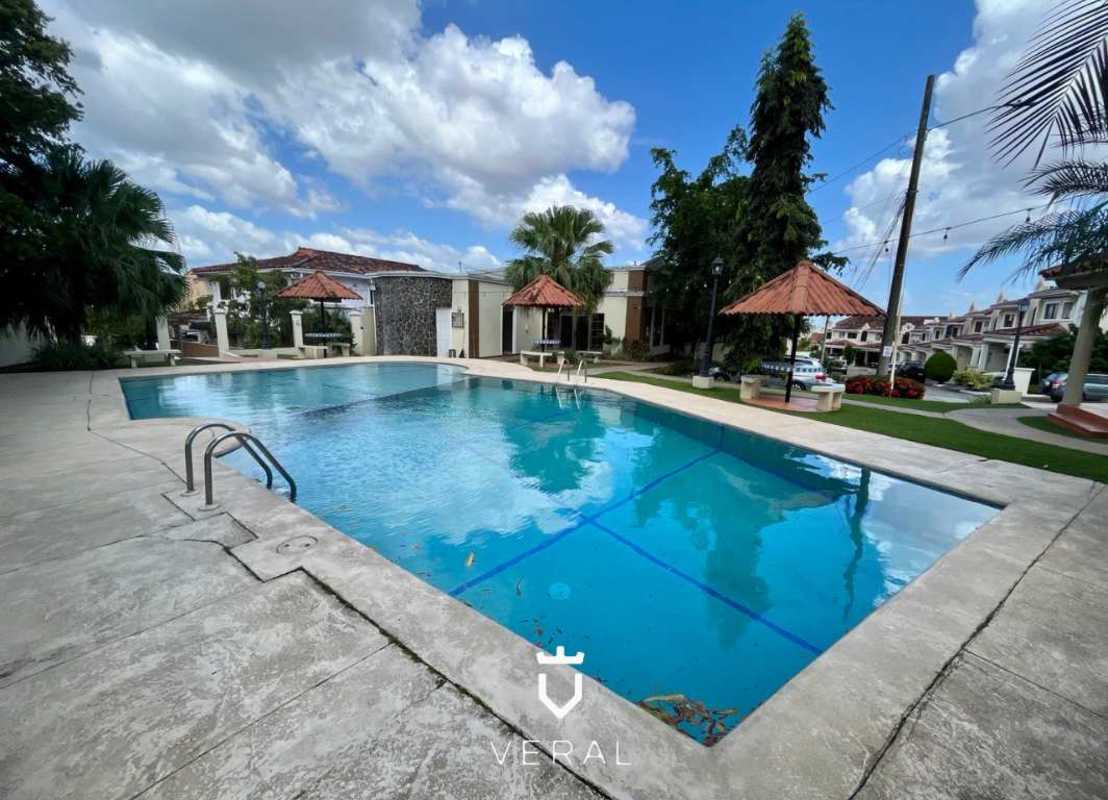 Community pool area with gazebo surrounded by gardens in Corona Gardens Panama