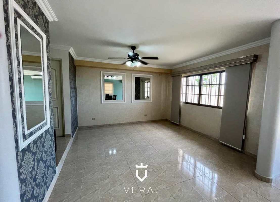 Open-plan living and dining room with marble floors, ceiling fans at Corona Gardens Betania