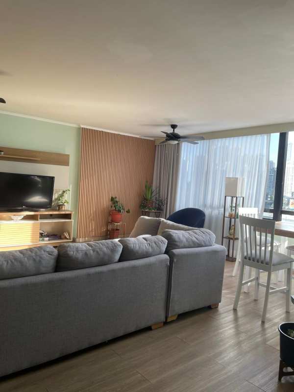 Modern bedroom with large window overlooking city skyline in Obarrio downtown Panama