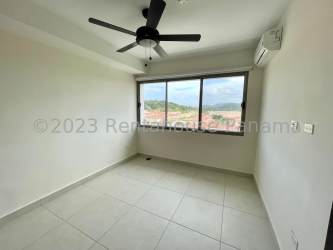 Modern kitchen with granite counters and appliances in Panama Pacifico apartment