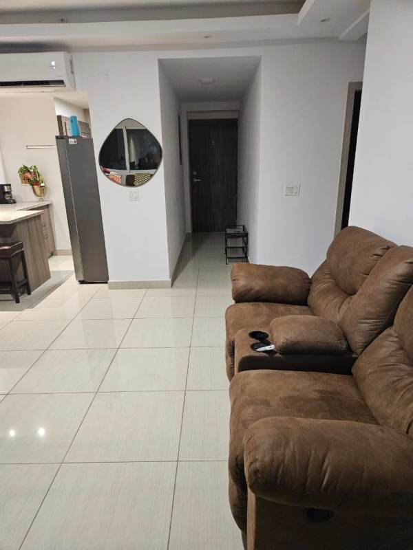 Kitchen with granite counter, stools and contemporary appliances in PH 43 GV Bella Vista Panama City