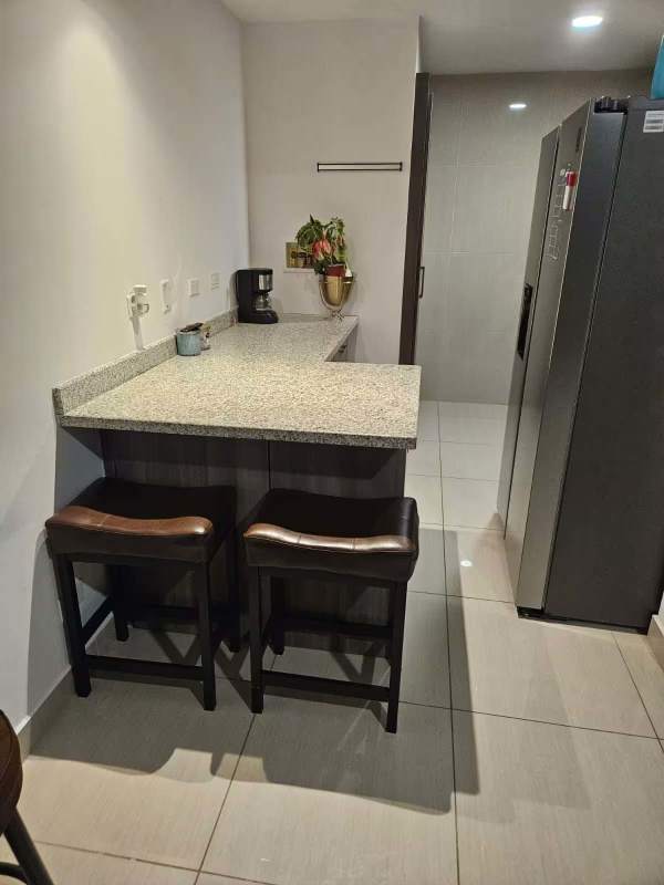 Bedroom with city night view, work desk and bed in PH 43 GV Bella Vista Panama City