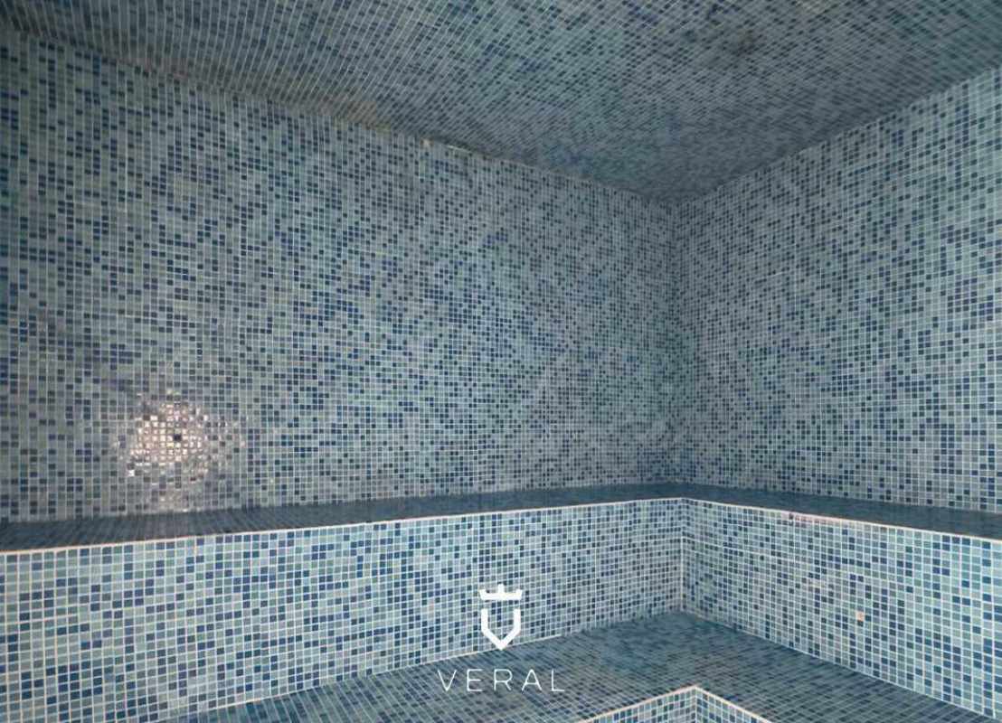 Spa-style steam room with blue mosaic tiles PH Terramar San Francisco Panama City