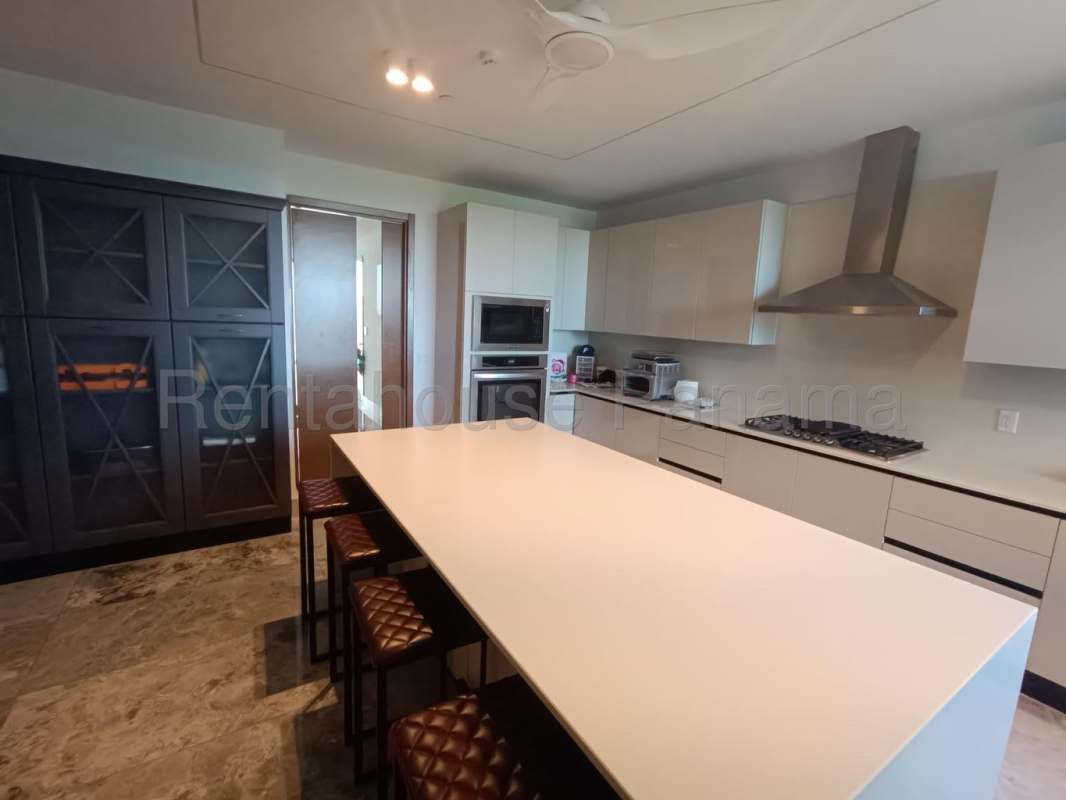 Elegant master suite with floor-to-ceiling windows and golf view at Santa María Panama