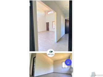 Bedroom with tiled floor and large window in new residential house David Panama