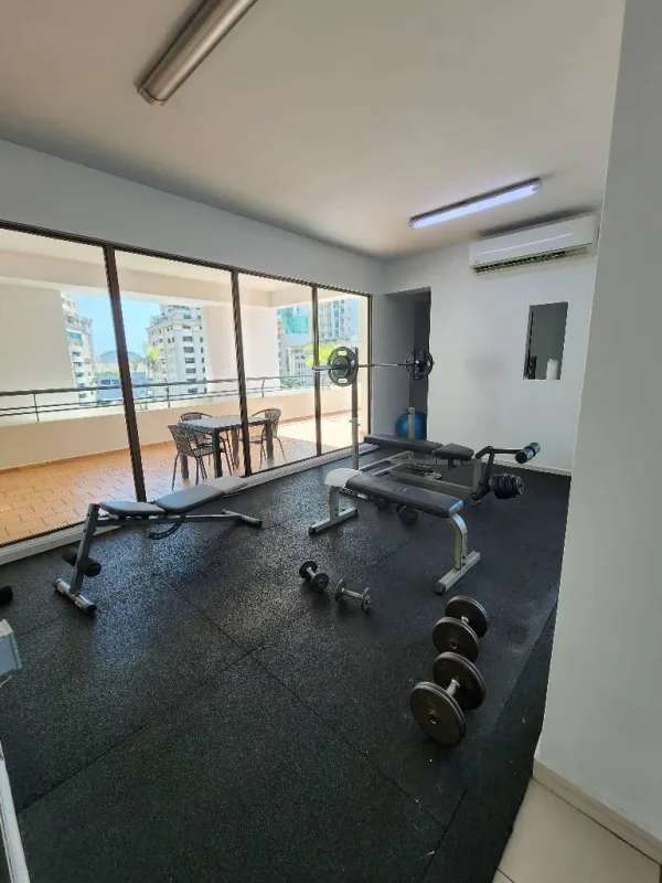 Spacious living dining area with large windows and accent wall PH Ocean View Tower Punta Paitilla Panama