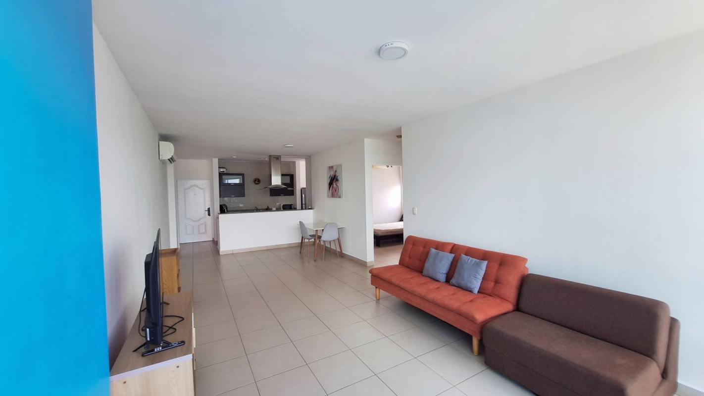 Bedroom with built-in closet, ceiling fan, large window city view PH Met One San Francisco Panama
