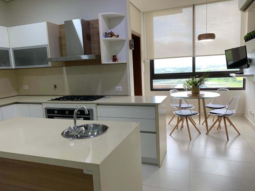 Bright second bedroom with panoramic windows overlooking city and greenery in La Vista on the Green Santa Maria Panama