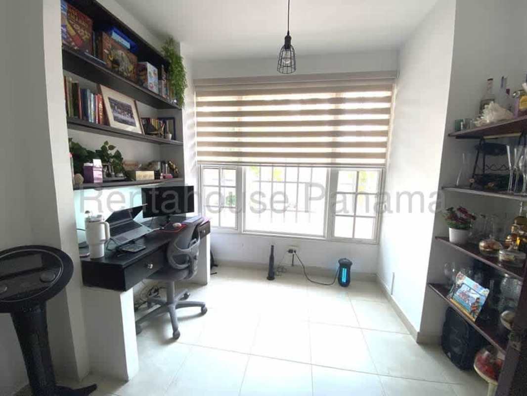 Well-equipped kitchen with modern appliances double sink and wood cabinets Villa Valencia Costa Sur Panama