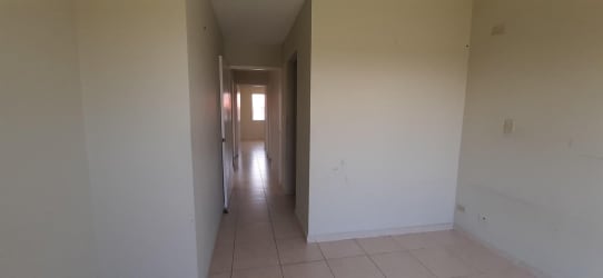 Single-family house exterior beige with white trim driveway front yard in La Chorrera