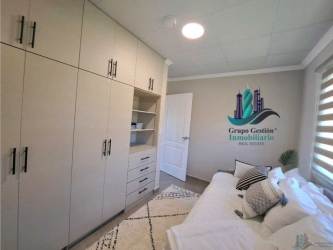 Bedroom with ceramic floor and large window in new affordable house David Panama