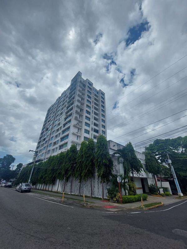 Kitchen with upper cabinets, tile backsplash and ceramic tile floors in PH Prisma Parque Lefevre Panama