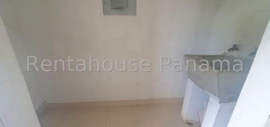 Bedroom with neutral colors and large window in La Chorrera house for sale