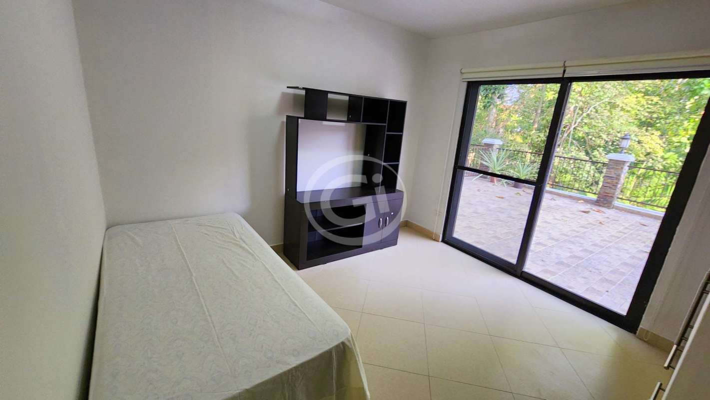 Bright bedroom with built-in wardrobe, windows to balcony and garden in Embassy Club Courtyard Clayton