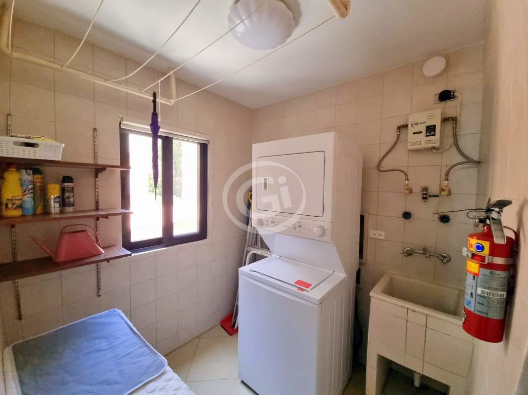 Laundry room with washer dryer utility sink Embassy Club Courtyard Clayton Panama