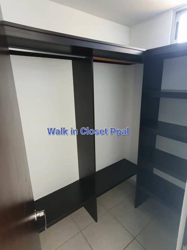 Spacious walk-in closet with built-in organizers in master bedroom PH Alsacia Panama City