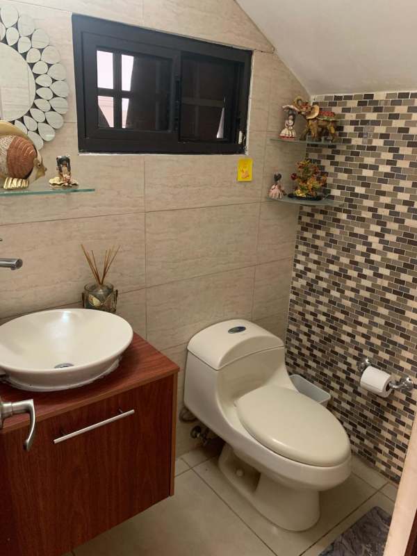 Modern half bathroom with vessel sink mosaic accent wall in PH Olymphus Brisas del Golf Panama