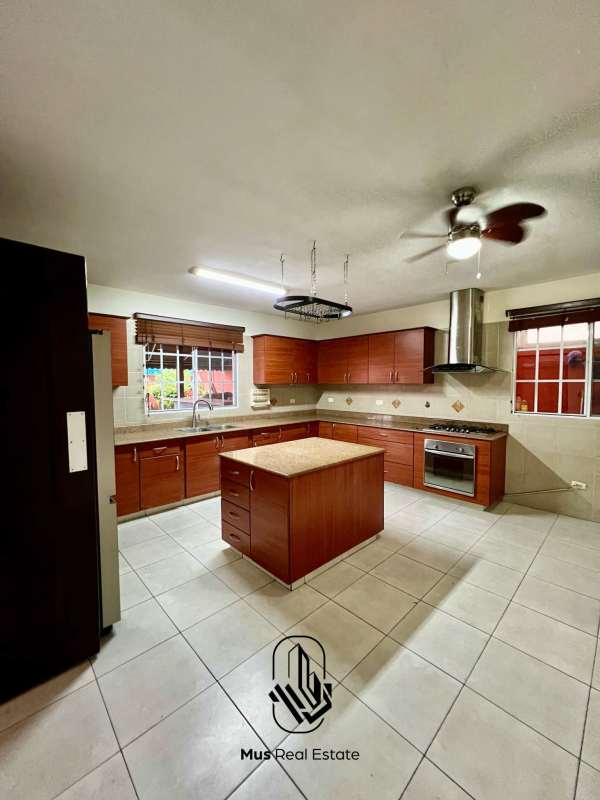 Large covered patio with BBQ area and seating space in PH Castel Novo Chanis Panama